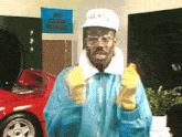 a man wearing gloves and a hat that says glass on it