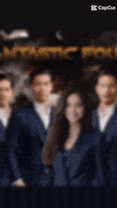 a group of people standing next to each other with fantastic four written on the bottom