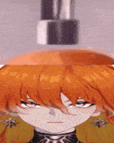 a close up of a girl 's face with orange hair