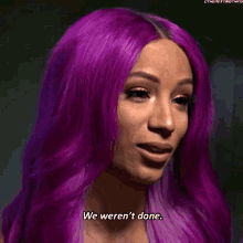 a woman with purple hair says we weren 't done .