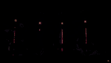 a person holding a light saber in the dark with a x on the bottom right