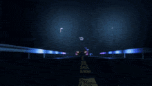 a car is driving down a road at night
