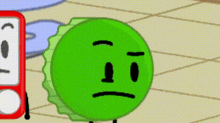 a green bottle cap with a sad face is standing next to a red alarm clock .