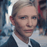 a close up of a woman 's face with netflix on the bottom right