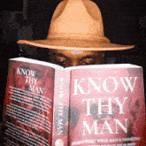 a man is reading a book called know thy man