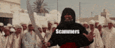 a man holding a sword in front of a crowd of people with the word scammers written on the bottom