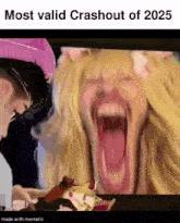 a woman is screaming with her mouth open in front of a man and a cat .