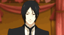 a man in a suit and tie is smiling and looking at the camera