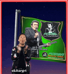 a man singing into a microphone while holding a green flag that says forsa