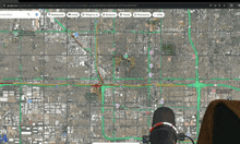 a computer screen shows a map of a city and a microphone