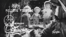 a black and white photo of dolls with the words felices fiestas