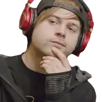 a man wearing red headphones and a black hat looks at the camera