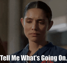 a woman says tell me what 's going on in front of her face