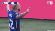 a soccer player wearing a jersey with the number 32 on it