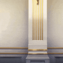 a white wall with gold stripes and a pillar