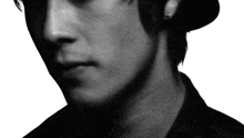 a close up of a person 's face with a hat on