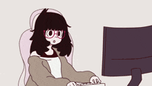 a girl with glasses is typing on a keyboard in front of a computer monitor