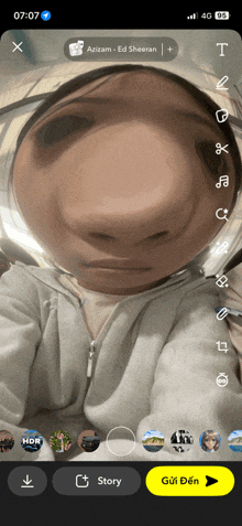 a phone screen shows a person taking a selfie with the name azizam on the top