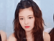 a close up of a girl with the name njzfaerie on her face