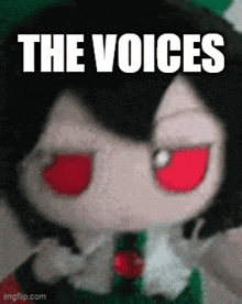 a stuffed doll with red eyes and the words the voices