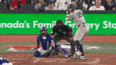 a baseball player with the number 99 on his jersey swings at a ball