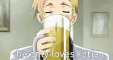 a man is drinking a glass of beer with the words `` he only loves katja '' written on the bottom .