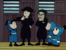 a group of ninjas are standing next to each other and one has the letter h on his shirt