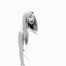a black and white photo of a woman wearing a white tank top and white pants .