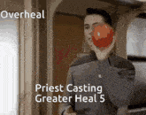 a man holding a red apple in his hand with the words overheal priest casting greater heal 5 below him