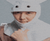 a blurry picture of a man in a bunny mask