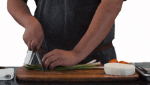 slicing green onion two plaid aprons preparing the green onion cutting the green onion