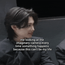 a man in a suit has a caption that says me looking at the imaginary camera every time something happens