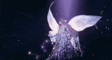 a fairy in a purple dress is surrounded by purple lights