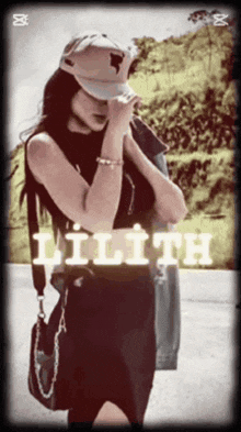 a woman wearing a hat with the word lilith written on it
