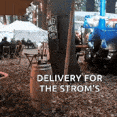 a sign that says delivery for the strom 's is in front of a group of people