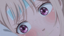 a close up of a girl 's eyes with a bandage on her forehead