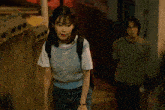 a girl holding a fan that says ' snoopy ' on it