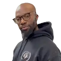 a man wearing glasses and a black hoodie with the letters eg on the front