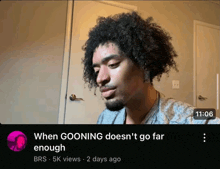 a video of a man with curly hair is titled when gooning doesn 't go far enough