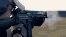 a close up of a person holding a rifle with a sticker on it that says ' d.s.c. '