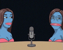 two women with blue faces are sitting at a table with a microphone in front of them .