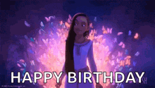 a girl with long hair is standing in front of a fire with the words `` happy birthday '' written below her .