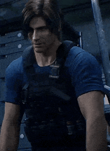 a man in a blue shirt and black vest is standing in a room with a gun .