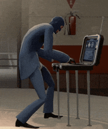 a man in a blue suit is looking at a briefcase