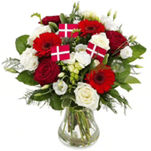 a bouquet of red white and green flowers in a glass vase