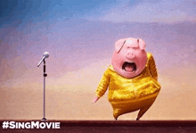 a pig is singing into a microphone in front of a crowd .