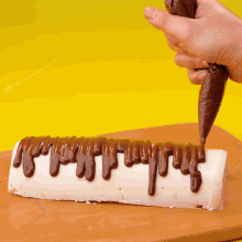 a checkered table cloth is on a table next to a chocolate gun