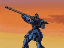 a blue robot is holding a rifle in front of a sunset