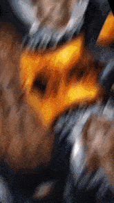 a blurred image of a person 's face with a yellow object in the foreground