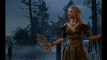 a woman with long blonde hair stands in front of a forest
